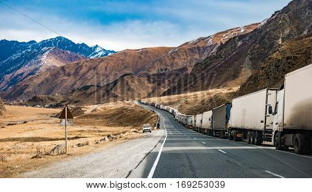 military road in Georgia with truks queue