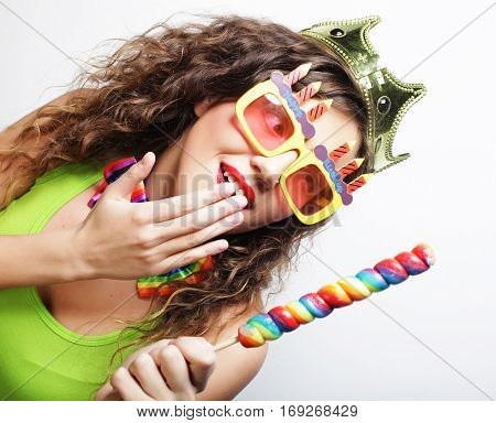 Young woman having fun. Young pretty woman with crown is laughin