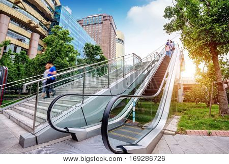 The escalator of the skyscraper building on the streets of Shanghai.