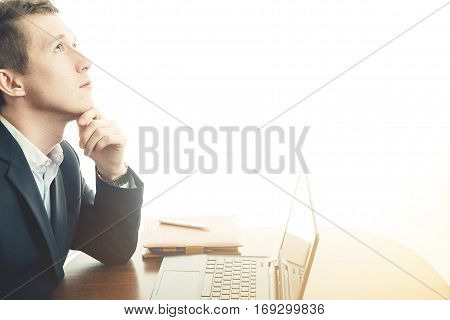 business man working at office with laptop on his desk