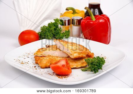 Juicy chicken fillet in beer batter with herbs and spices