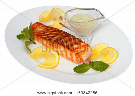 Hot Dish Of Grilled Salmon On Plate With Sauce