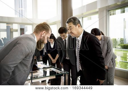 Business Partners Introductionary Handshake Bow