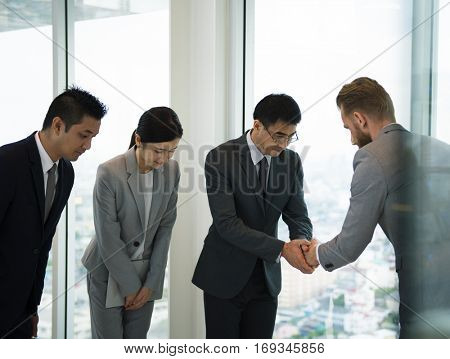 Business Partners Introductionary Handshake Bow