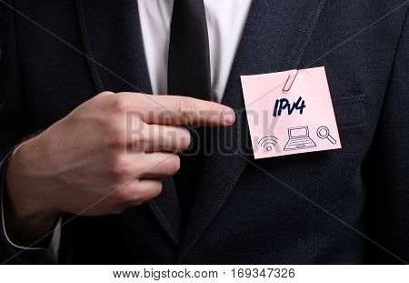Business, Technology, Internet And Network Concept. Young Businessman Shows The Word: Ipv4