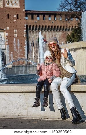 Mother And Daughter Near Sforza Castle In Milan Handwaving
