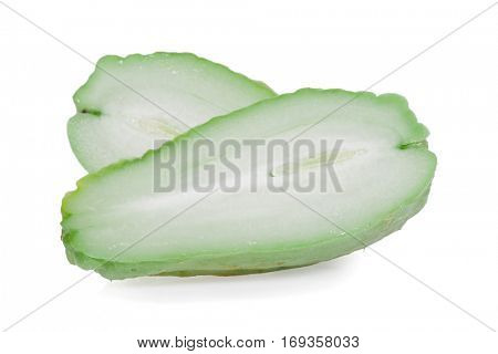 Chayotes isolated on white background, with one Chayote cut in half showing the pulp or flesh