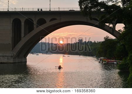 Washington DC - Key Bridge silhouette with kayaking people in Potomac River