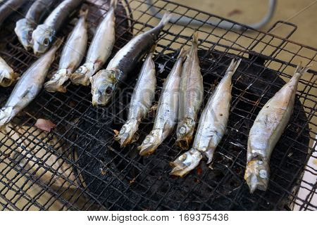 Japanes Grilled fish on steel iron mesh.