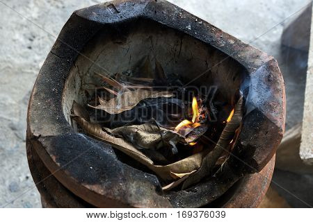 Flame in vintage THAI stove made from clay.