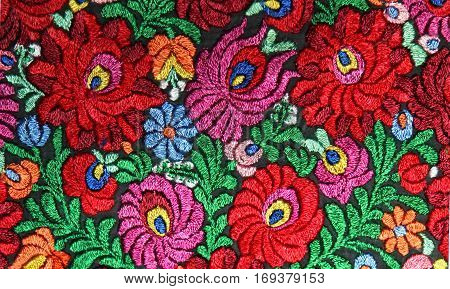 multicolor floral hand embroidery pattern macro image