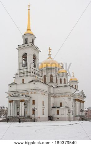 View of Novo-Tikhvinsky women monastery in Ekaterinburg at overcast snowy day in winter.