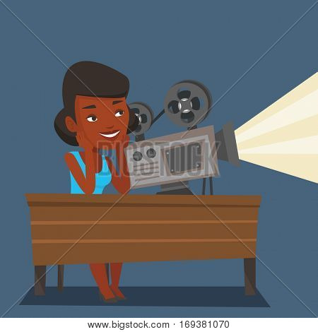 An african projectionist showing new film. Woman sitting at the table with film projector in the room of projectionist. Young projectionist at work. Vector flat design illustration. Square layout.