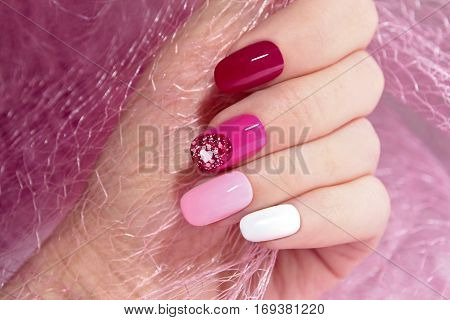 Pink cherry nail design for nail glitter different shapes closeup.