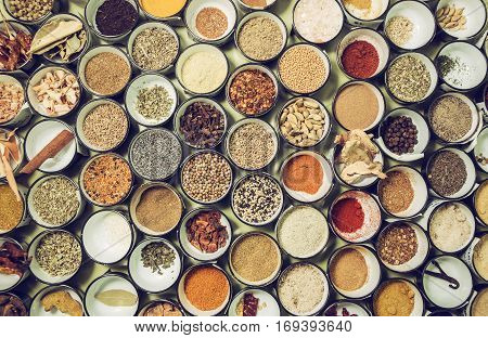 background texture of all sorts of spices in small bowls