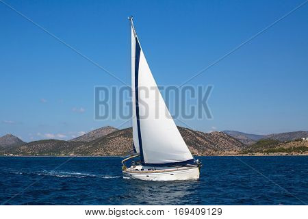 Luxury yachts. Sailing ship boats with white sails in the Sea. 