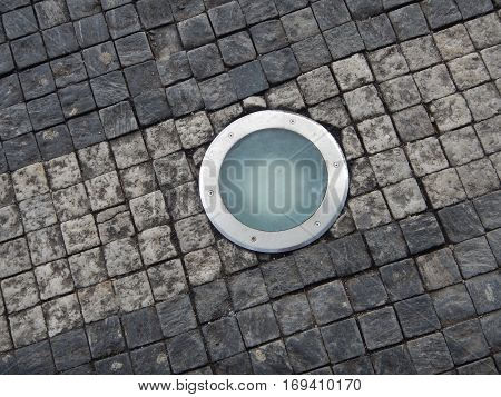 Roung Light In A Cobble Stone Pavement