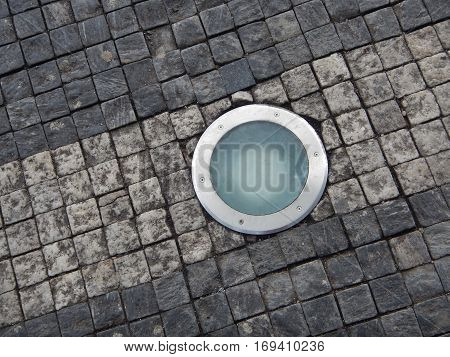 Roung Light In A Cobble Stone Pavement