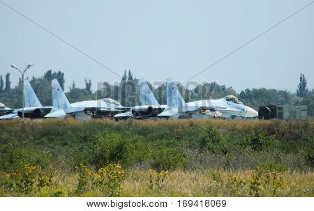 Military Airfield And Parking Lots Of Planes.