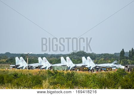 Military Airfield And Parking Lots Of Planes.