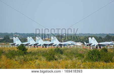 Military Airfield And Parking Lots Of Planes.