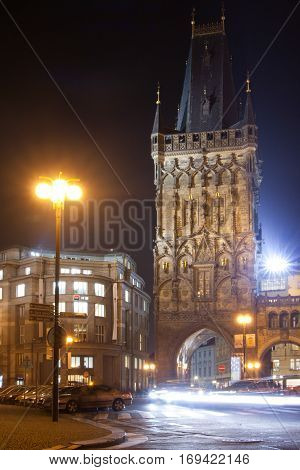 Night View Of The Powder Tower Or Powder Gate. This Landmark Is A Gothic Tower In Prague, Czech Repu