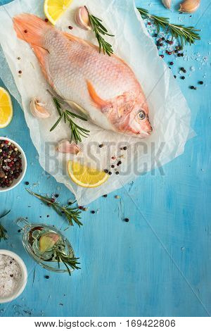 Fresh raw fish tilapia. Nile tiapia Oreochromis niloticus. Top view. Food cooking background.