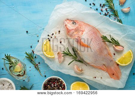 Fresh raw fish tilapia. Nile tiapia Oreochromis niloticus. Top view. Food cooking background.
