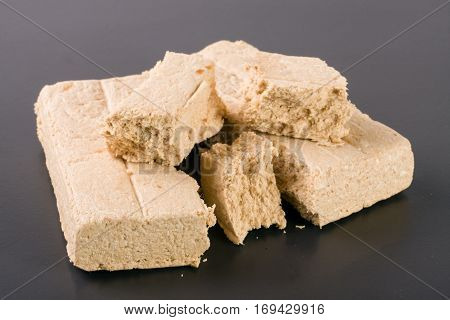 peanut halva on a dark background closeup.