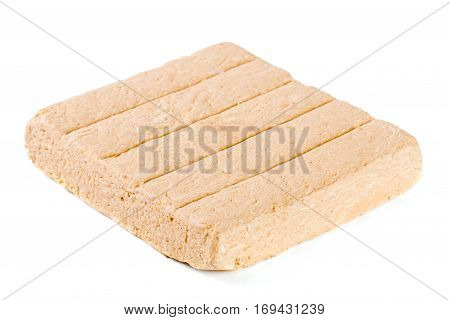 peanut halva isolated on white background close-up.