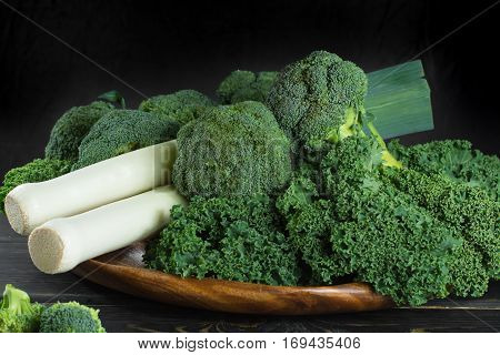 Green winter fresh organic superfood - Kale green cabbage broccoli and leeks prei