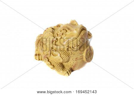 Traditional chinese yellow frog with coins isolated on white background. Feng Shui statuette.