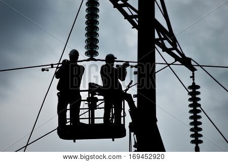 Power line support insulators and wires. Appearance of a design. Assembly and installation of new support and wires of a power line.