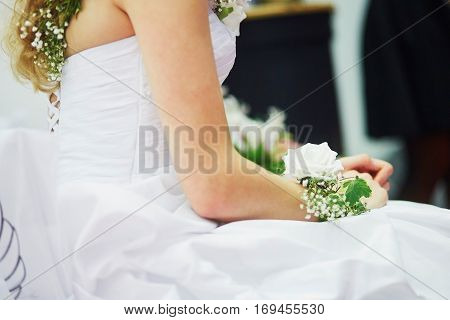 Young Bride With Flower Decorations On Her Wristle