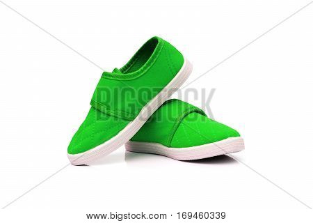 Green slip on shoes isolated on white