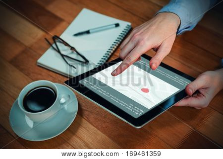 Navigation map on smartphone screen against cropped image of human hand using digital tablet