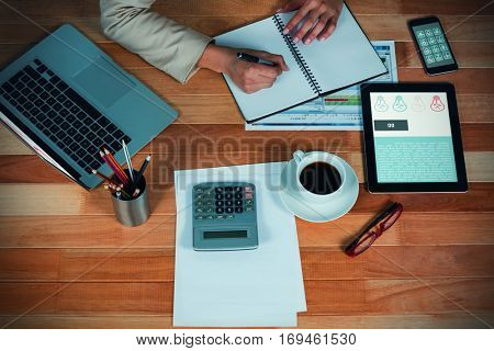 Go and lightbulbs icons against businesswoman writing on diary