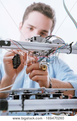 Young Engineer Using A 3D Printer