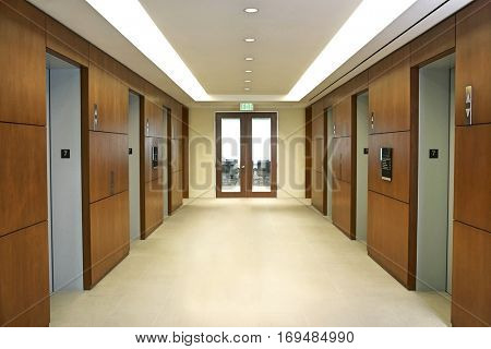 Empty hallway between elevators