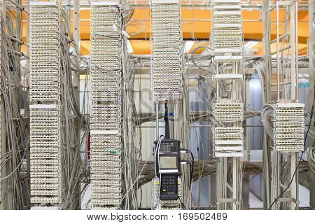 Digital cable analyzer on rack mounted server in server room
