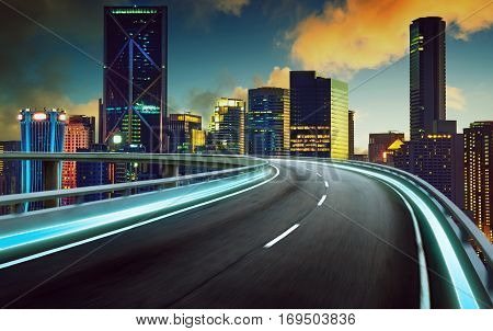 Highway overpass motion blur with city background . night scene .