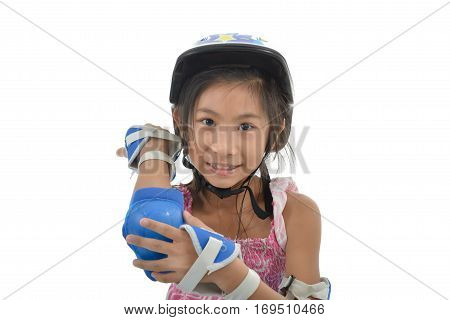 Happy Asian girl wearing hand and headguard for playing rollerskates  on white.