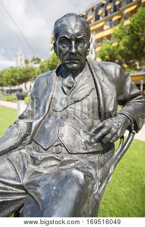 MONTREUX,SWITZERLAND-September 6: bronze statue of Vladimir Nabokov ,russian-american novelist, author of famous Lolita in the gardens of the Montreux Palace hotel in Montreux, Switzerland on September 6, 2016