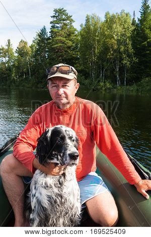The man in red with a dog. Tagasuk lake, Siberia