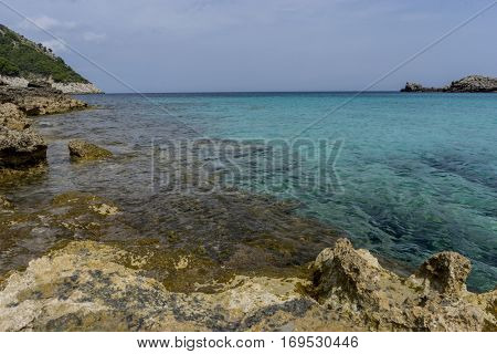 Touristic, Rocks by the Mediterranean sea on the island of Ibiza in Spain, holiday and summer scene