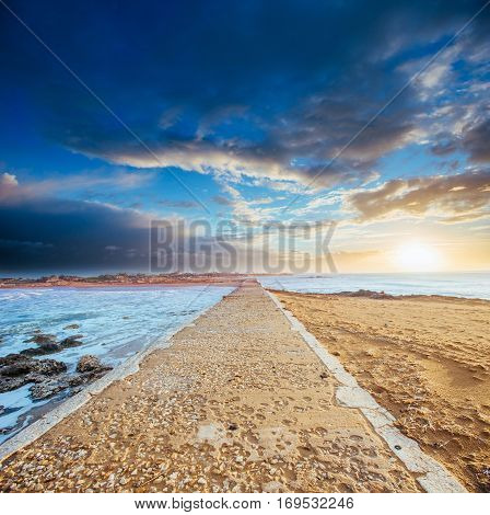 Stone road by the sea, water on both sides