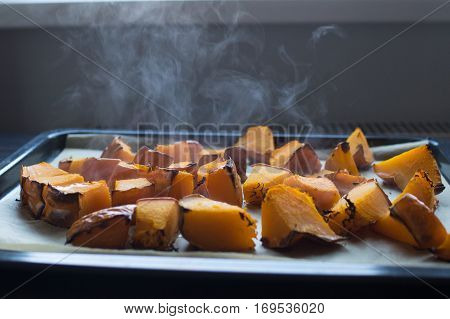 roasted pumpkin slices on a baking sheet