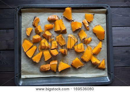 roasted pumpkin slices on a baking sheet