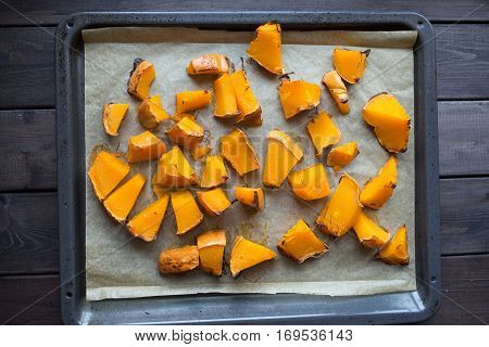 roasted pumpkin slices on a baking sheet