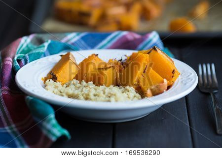 a dish of cooked pumpkin and quinoa.